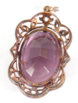 Lot 107 - An amethyst and diamond pendant, the oval claw...