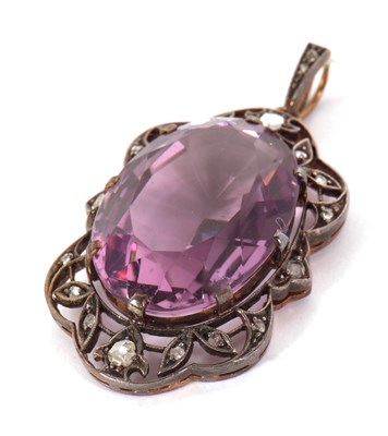 Lot 107 - An amethyst and diamond pendant, the oval claw...