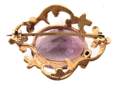 Lot 87 - A 9ct amethyst brooch, the oval claw mounted...