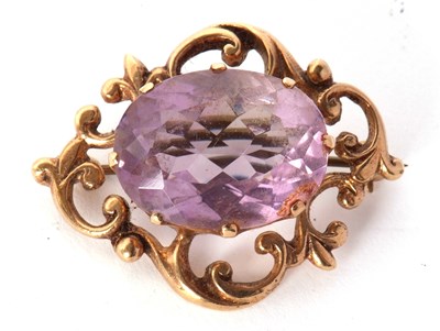 Lot 87 - A 9ct amethyst brooch, the oval claw mounted...