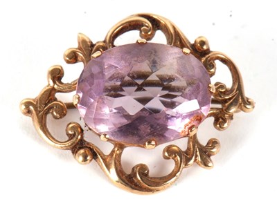 Lot 87 - A 9ct amethyst brooch, the oval claw mounted...