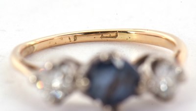 Lot 29 - A sapphire and diamond ring, the round mixed...
