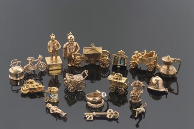 Lot 338 - A quantity of gold charms, to include an 18ct...