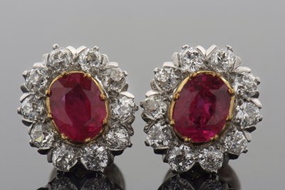 Lot 315 - A pair of ruby and diamond cluster earstuds,...