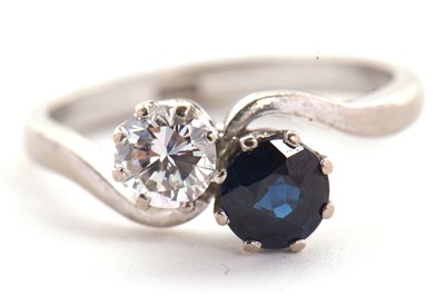Lot 57 - A sapphire and diamond 'toi et moi' ring, the...