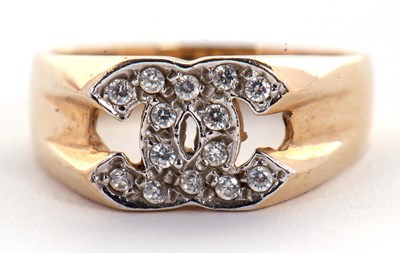 Lot 14 - A 9ct ring, set with two interlocking C's set...