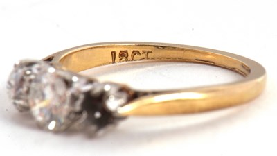 Lot 79 - A three stone diamond ring, the three...