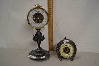 Lot 50 - Brass cased aneroid barometer on a spelter...