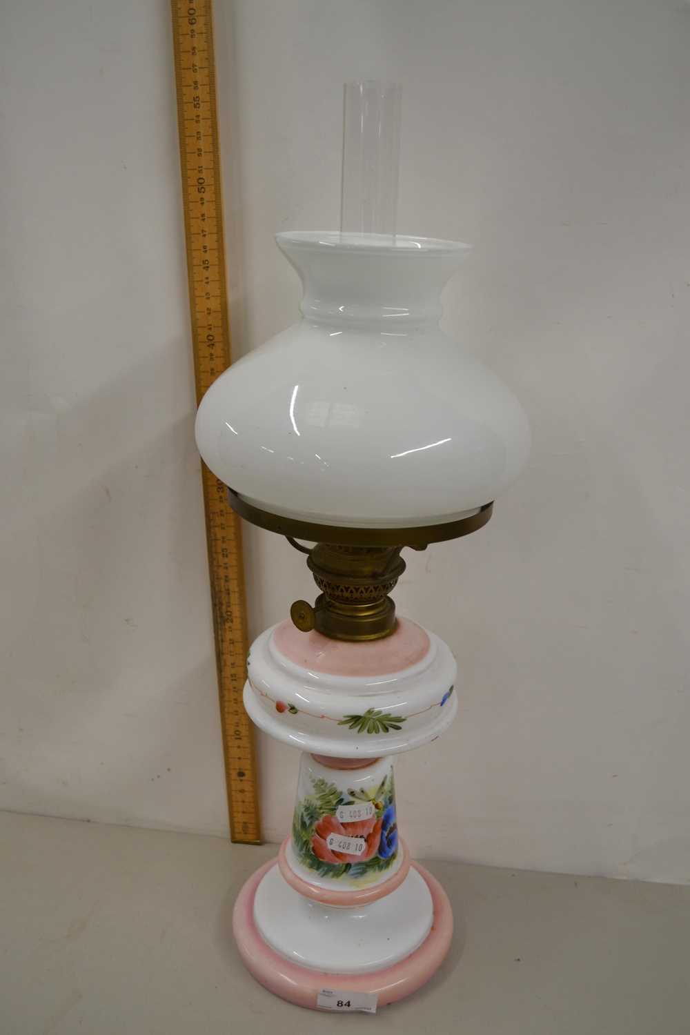 Lot 84 - Oil lamp with a milk glass body with painted...