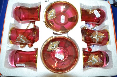 Lot 180 - A case of gilt finish ruby glass cups, saucers...