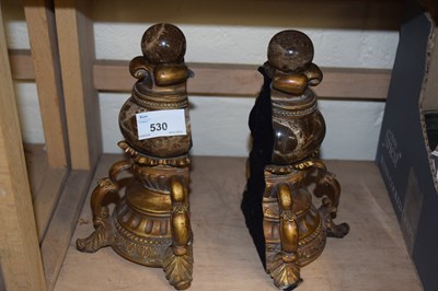 Lot 530 - A pair of stone and resin book ends