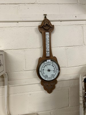 Lot 233 - An early 20th Century oak cased barometer