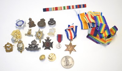 Lot 169 - Quantity of medal ribbons and cap badges to...