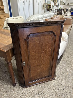 Lot 255 - Georgian oak corner cabinet with painted interior