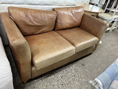 Lot 257 - Brown leather two seater sofa