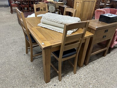 Lot 267 - Modern extending oak dining table and four chairs