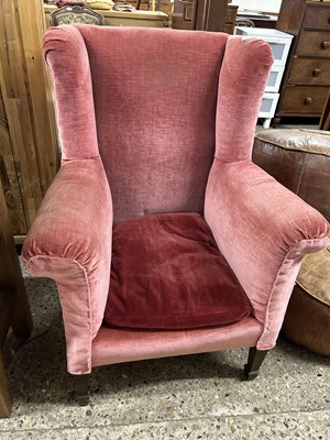 Lot 271 - An early 20th Century wing back armchair