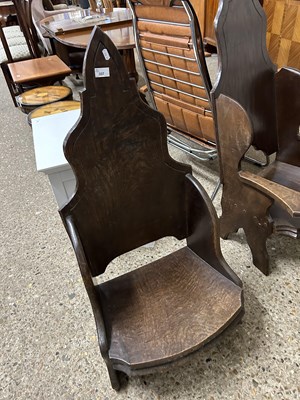 Lot 337 - A pair of low oak throne style chairs, one...