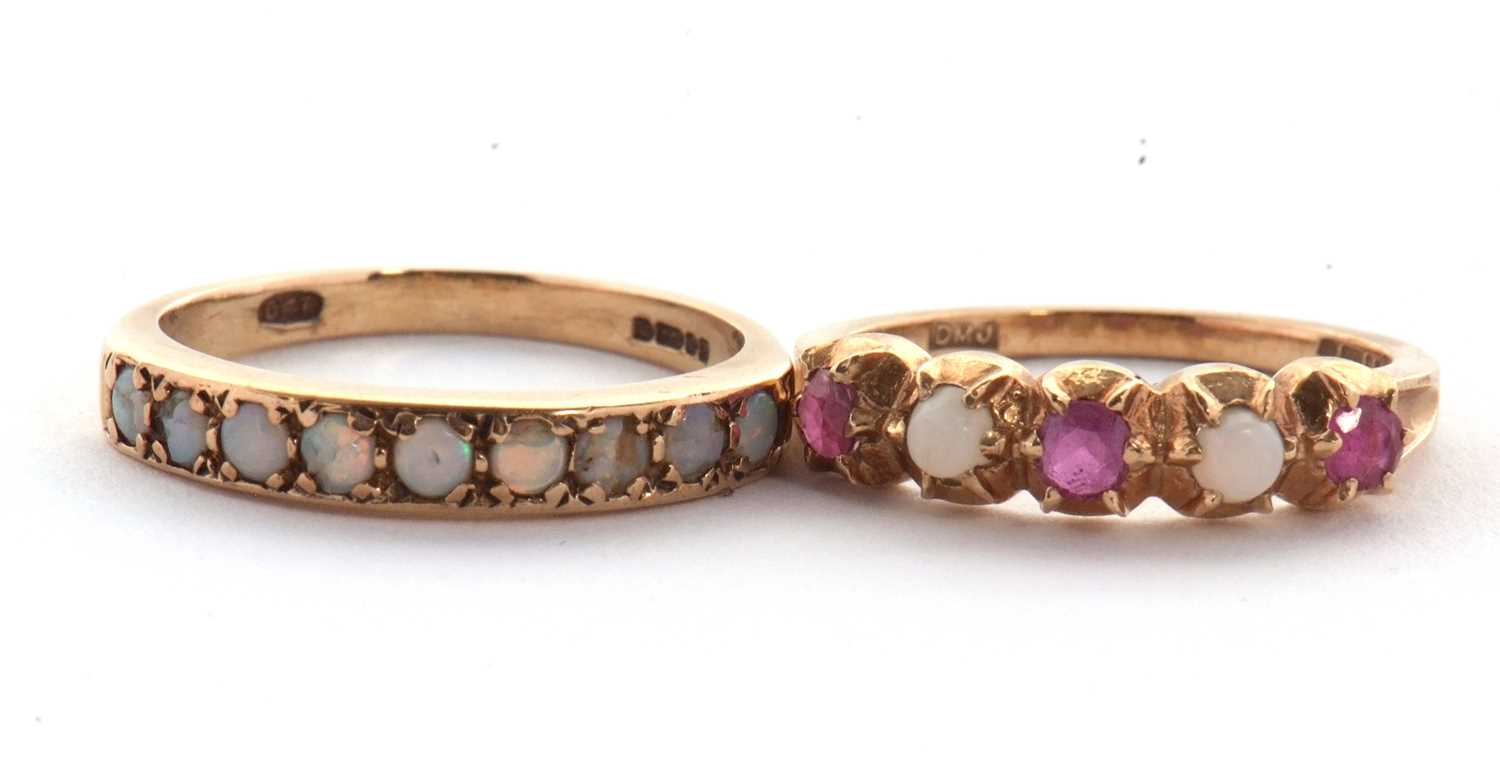 Lot 16 - Two 9ct half hoop gemset rings, the first set...