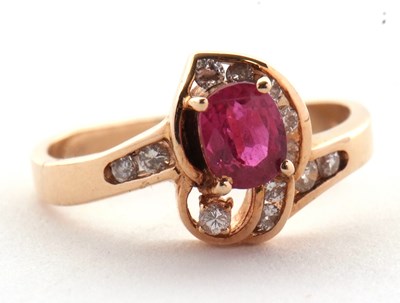 Lot 48 - A 14k ruby and diamond ring, the central four...