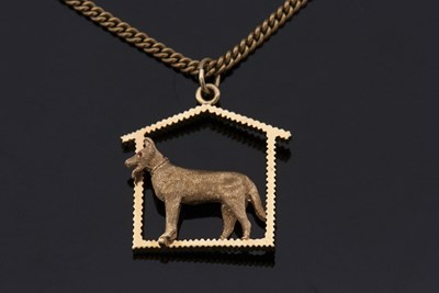 Lot 334 - A 14k German Shepherd pendant and 10k chain,...