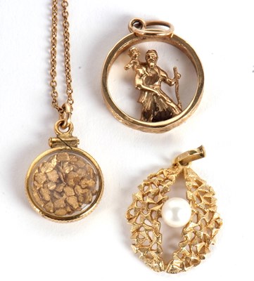 Lot 204 - Two 9ct pendants and another pendant and chain,...
