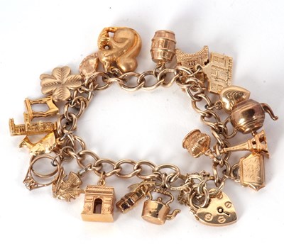 Lot 210 - A 9ct charm bracelet, the curblink bracelet...