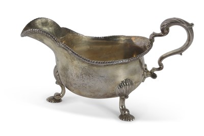 Lot 215 - George II silver sauce boat of typical form...