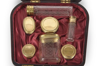 Lot 216 - An Asprey & Co cased set of silver-gilt topped...
