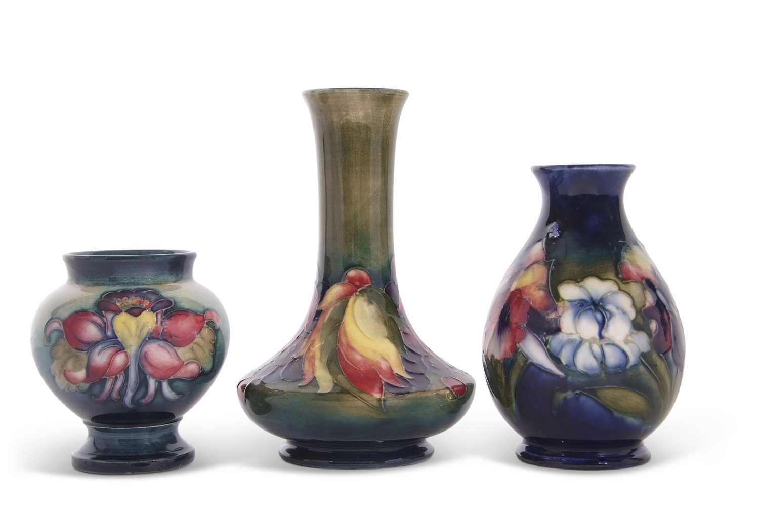 Lot 49 - A group of three small Moorcroft vases, one...
