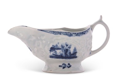 Lot 67 - A small Lowestoft sauce boat with reserves of...