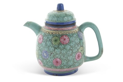 Lot 112 - A Qing Dynasty pottery teapot with a famille...