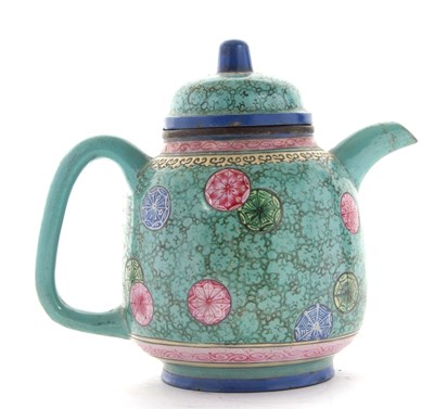 Lot 112 - A Qing Dynasty pottery teapot with a famille...