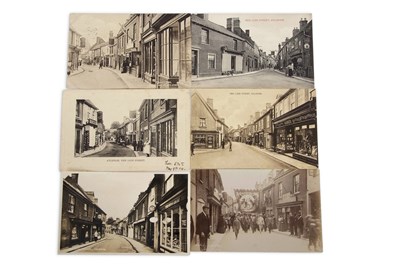 Lot 127 - An interest postcard album with views of...