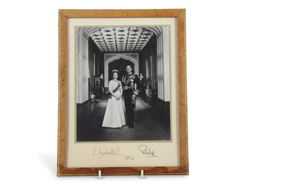 Lot 129 - A framed signed photograph of Elizabeth II and...