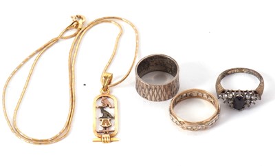 Lot 196 - An Egyptian necklace and three rings, the...