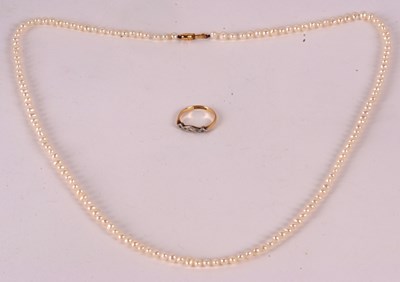 Lot 212 - A diamond ring and a cultured pearl necklace,...