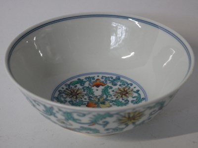 Lot 257 - A Chinese Wucai bowl with flowerheads amongst...