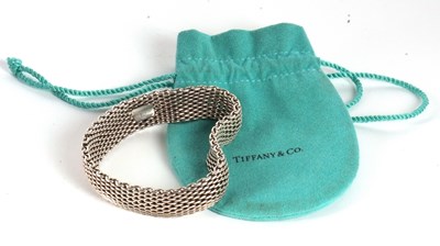 Lot 103 - A Tiffany silver bracelet, the 5.5mm wide...