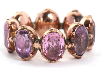 Lot 331 - A 19th century foil backed amethyst eternity...