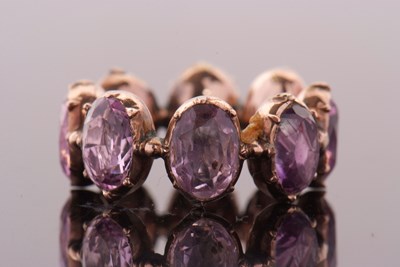 Lot 331 - A 19th century foil backed amethyst eternity...