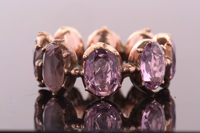 Lot 331 - A 19th century foil backed amethyst eternity...