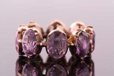 Lot 331 - A 19th century foil backed amethyst eternity...