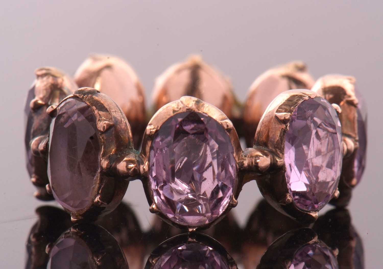 Lot 331 - A 19th century foil backed amethyst eternity...