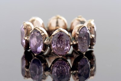 Lot 331 - A 19th century foil backed amethyst eternity...