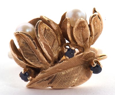 Lot 30 - A cultured pearl and sapphire floral ring, the...
