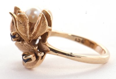 Lot 30 - A cultured pearl and sapphire floral ring, the...