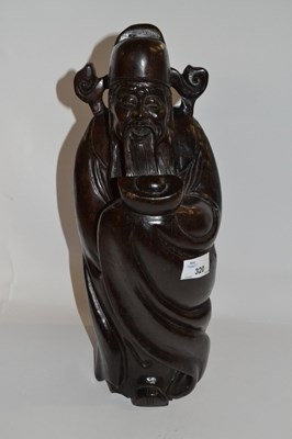 Lot 320 - A Chinese carved hardwood figure of Shoulai...
