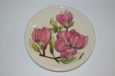 Lot 342 - A Moorcroft dish in the Magnolia pattern 26cm...