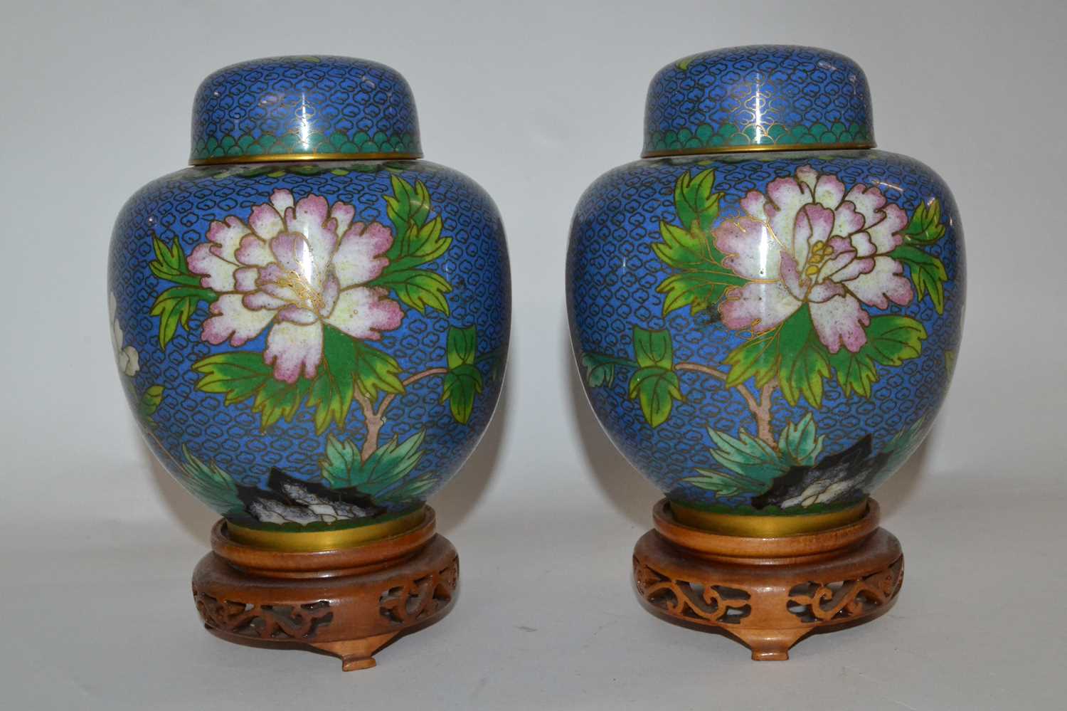 Lot 374 - A pair of Cloisonne jars and covers, the blue...